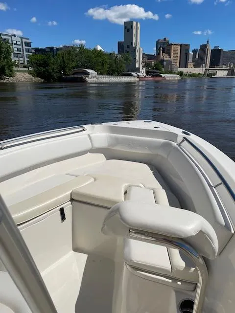 Slide: The Image of 2015 Sailfish 220 boat on a river with cityscape background. - 3