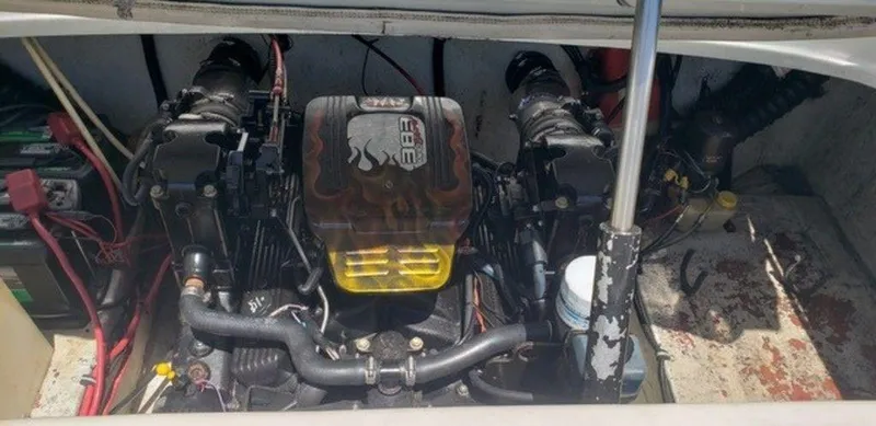 Slide: The Image of 1998 Baja 252I boat engine compartment with dual engines and wiring. - 5