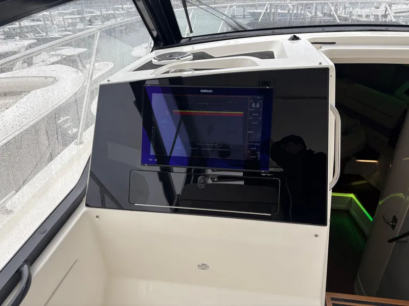 Slide: The Image of 2025 Boston Whaler 365 Conquest helm with modern navigation display. - 22