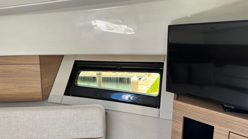 Slide: The Image of Interior of 2025 Boston Whaler 365 Conquest with window and TV. - 35