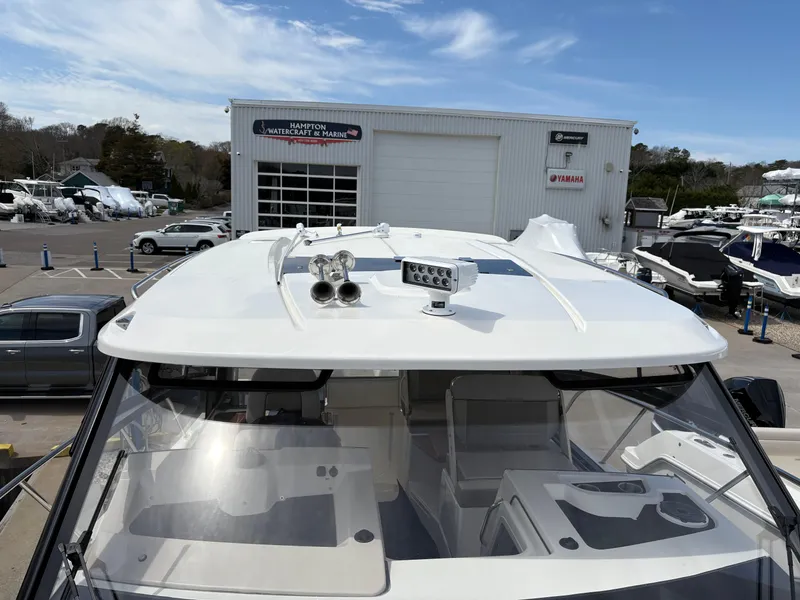 Slide: The Image of 2025 Boston Whaler 365 Conquest boat at marina, showcasing sleek design and advanced features. - 40