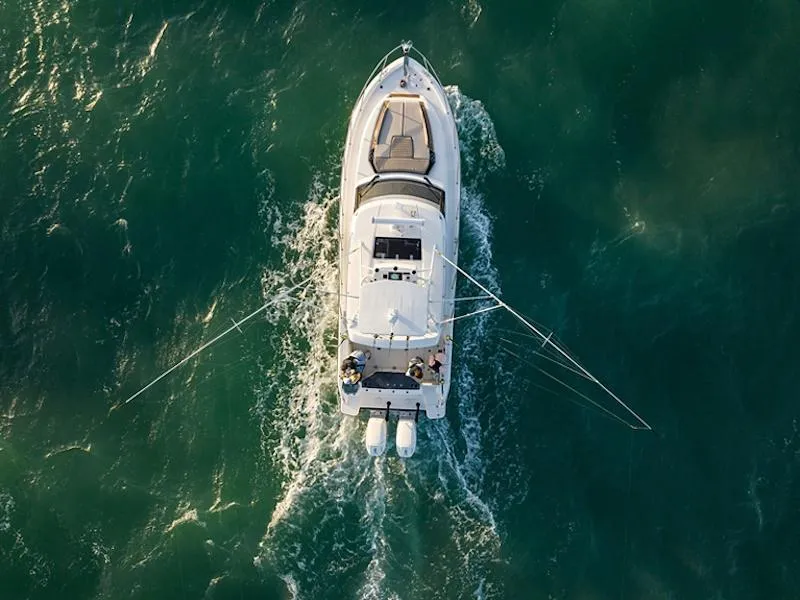 Slide: The Image of Aerial view of 2025 Boston Whaler 365 Conquest cruising on open water. - 48
