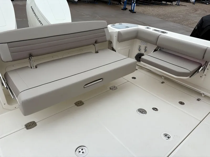 Slide: The Image of 2025 Boston Whaler 365 Conquest boat interior with foldable seating and storage. - 5