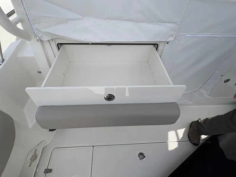 Slide: The Image of Open storage drawer on 2025 Boston Whaler 365 Conquest boat interior. - 9