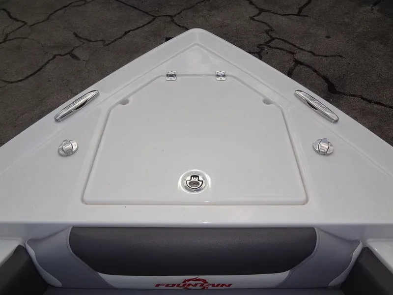 Slide: The Image of 2024 Fountain 32NX boat bow with storage compartment and cleats. - 12