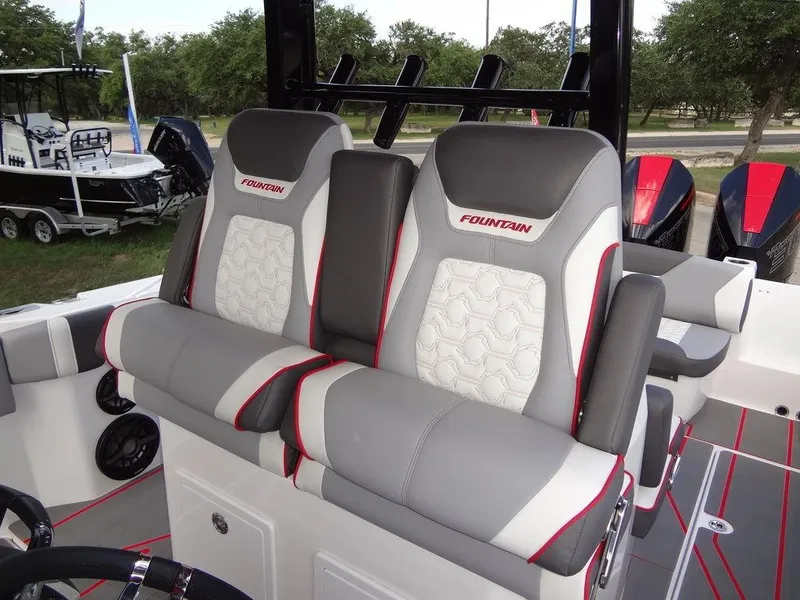 Slide: The Image of 2024 Fountain 32NX boat with luxurious seating and modern design. - 21
