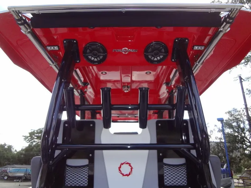 Slide: The Image of 2024 Fountain 32NX boat with red T-top and rod holders. - 25