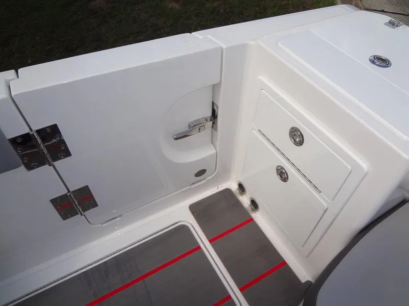 Slide: The Image of 2024 Fountain 32NX boat interior, featuring storage compartments and a sleek white finish. - 30