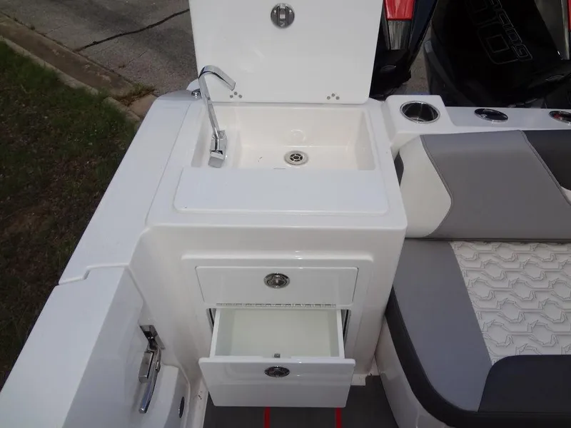 Slide: The Image of 2024 Fountain 32NX boat sink and storage drawers. - 32