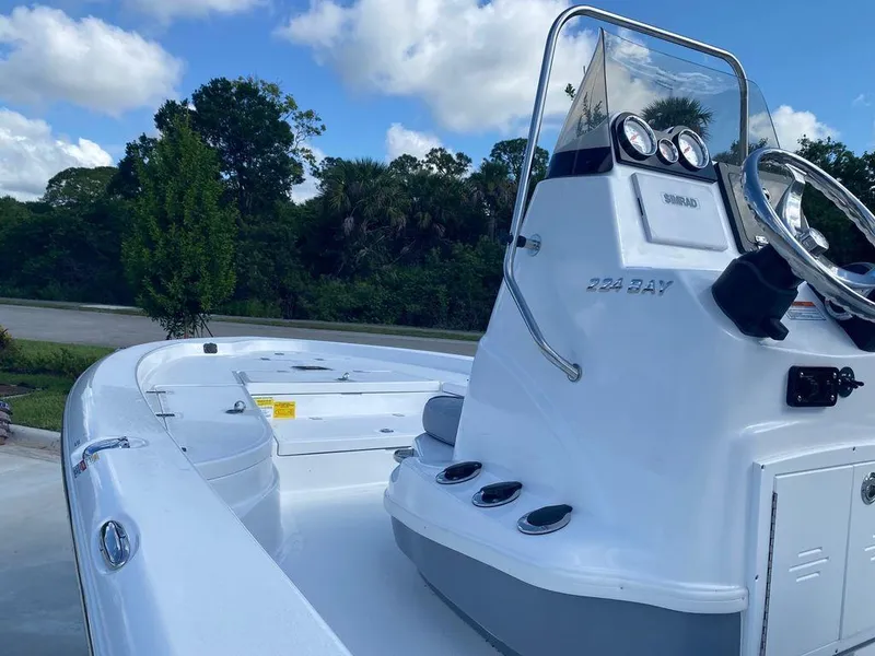 Slide: The Image of 2024 NauticStar 224 Bay boat with console and steering wheel. - 3