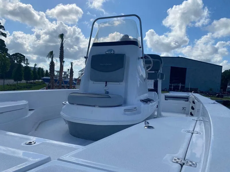 Slide: The Image of 2024 NauticStar 224 Bay boat with center console on a sunny day. - 4