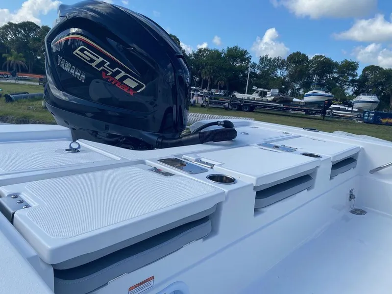 Slide: The Image of 2024 NauticStar 224 Bay boat with Yamaha SHO engine, docked outdoors. - 8