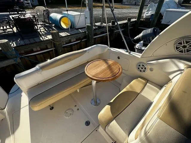 Slide: The Image of 2008 Sea Ray 280 Sundancer boat interior with seating and round table. - 3