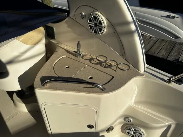 Slide: The Image of 2008 Sea Ray 280 Sundancer boat interior with sink and cup holders. - 4