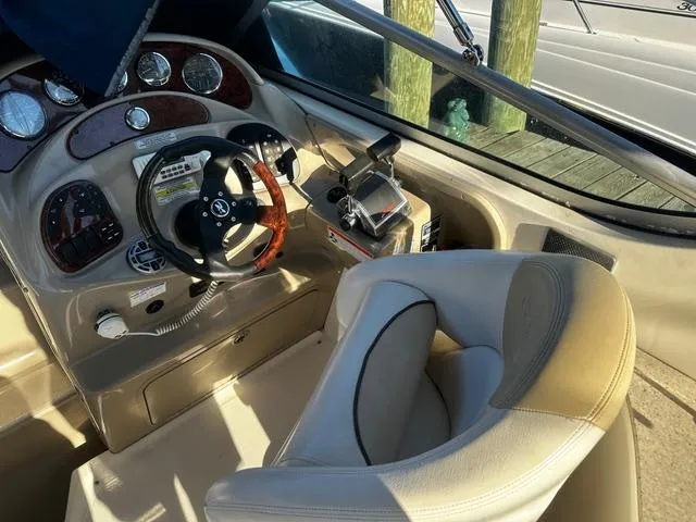 Slide: The Image of Cockpit of 2008 Sea Ray 280 Sundancer with steering wheel and control panel. - 5