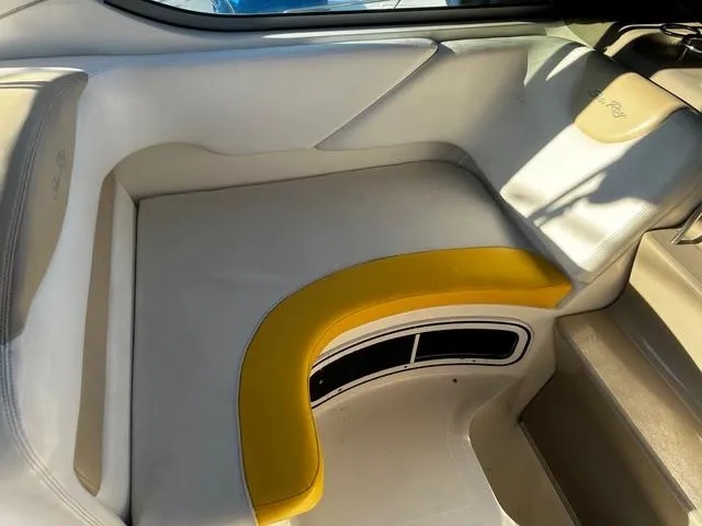 Slide: The Image of 2008 Sea Ray 280 Sundancer interior seating with yellow accent and modern design. - 7