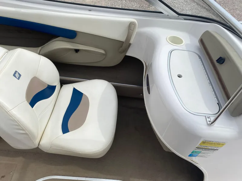 Slide: The Image of 1997 Four Winns 200 Horizon boat interior with white and blue seating. - 7
