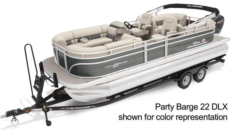 Slide: The Image of 2024 Sun Tracker Party Barge 20 DLX pontoon boat on trailer, beige seating. - 13