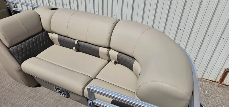 Slide: The Image of 2024 Sun Tracker Party Barge 20 DLX pontoon boat seating, beige upholstery, outdoor setting. - 6