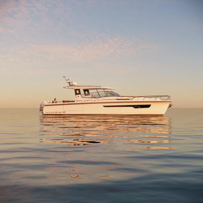 Slide: The Image of 2024 Nimbus W11 boat on calm water at sunset. - 7