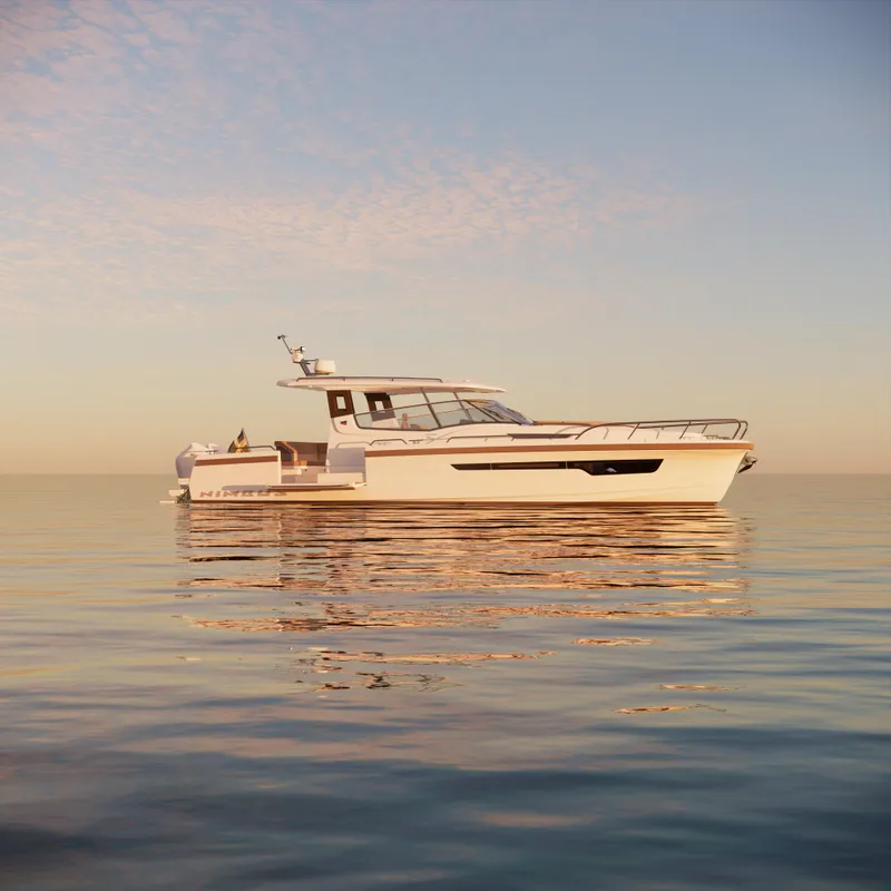 Slide: The Image of 2024 Nimbus W11 yacht on calm water at sunset. - 8