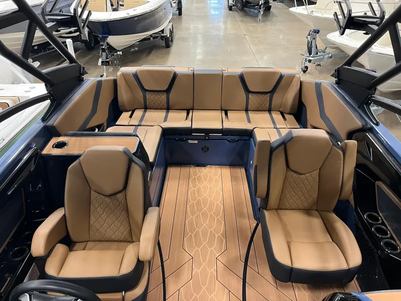 Slide: The Image of 2024 Yamaha Boats 255XD interior with luxurious tan seating and modern design. - 10