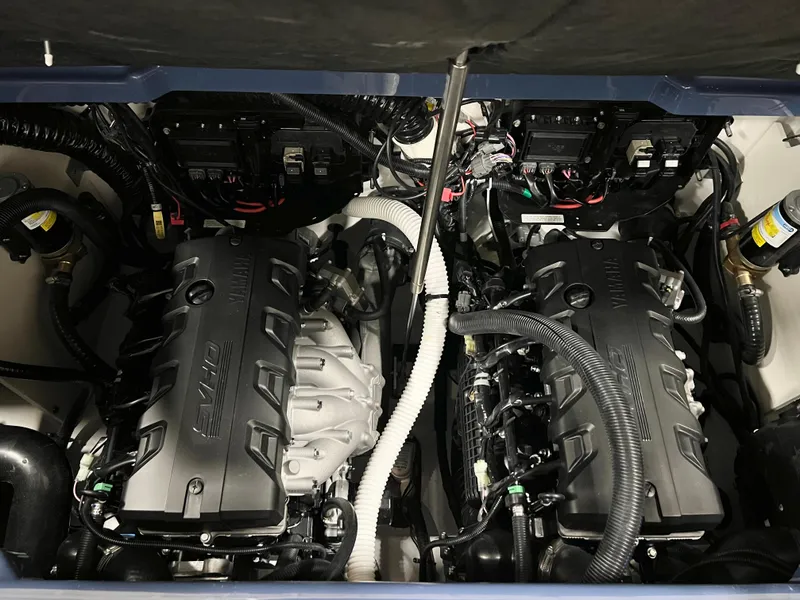 Slide: The Image of 2024 Yamaha Boats 255XD engine compartment with twin engines. - 11