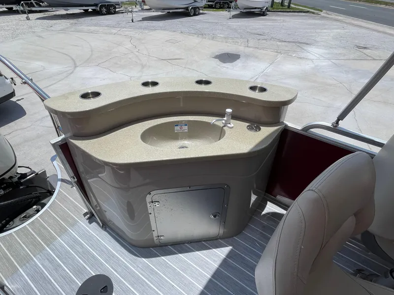 Slide: The Image of 2018 Berkshire 250E STS boat with built-in sink and storage compartment. - 11