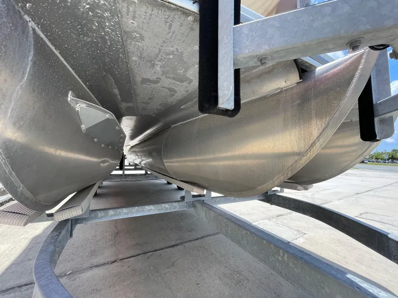Slide: The Image of Close-up of the underside of a 2018 Berkshire 250E STS pontoon boat. - 14