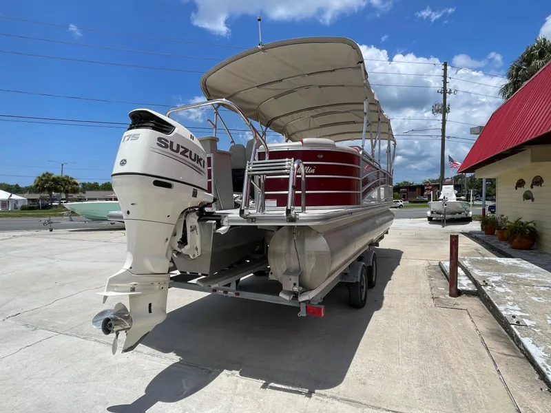 Slide: The Image of 2018 Berkshire 250E STS pontoon boat with Suzuki outboard motor on trailer. - 5