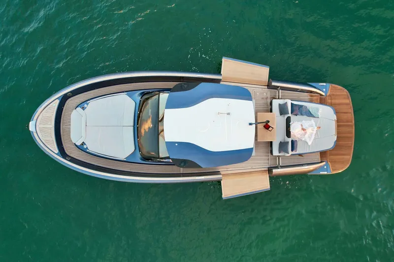 Slide: The Image of Aerial view of 2023 Solaris Power SP 44 yacht on turquoise water. - 16