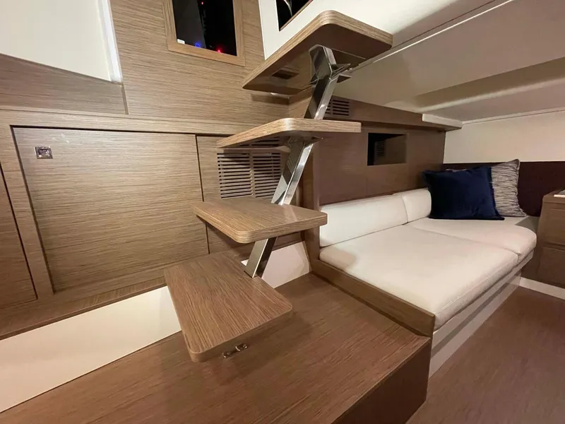 Slide: The Image of Modern interior of 2023 Solaris Power SP 44 yacht with wooden steps and cozy seating. - 2