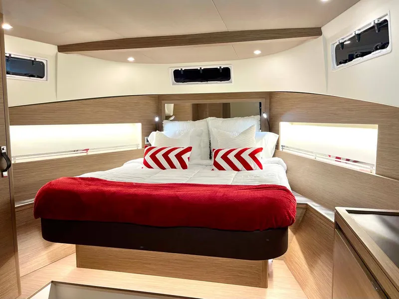Slide: The Image of Luxurious 2023 Solaris Power SP 44 yacht cabin with cozy bed and modern design. - 6