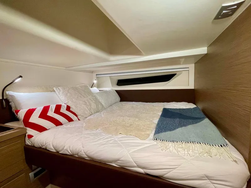 Slide: The Image of Luxurious cabin interior of 2023 Solaris Power SP 44 yacht with cozy bedding. - 7
