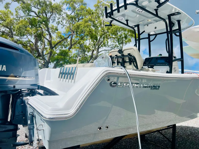 Slide: The Image of 2021 Sportsman Open 232 Center Console boat with Yamaha engine, parked outdoors. - 10