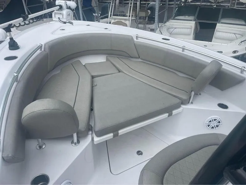 Slide: The Image of 2021 Sportsman Open 232 Center Console boat with cushioned seating area. - 3