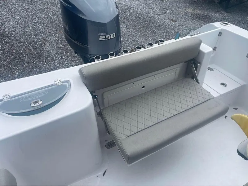 Slide: The Image of 2021 Sportsman Open 232 Center Console boat with Yamaha 250 engine and cushioned seating. - 5