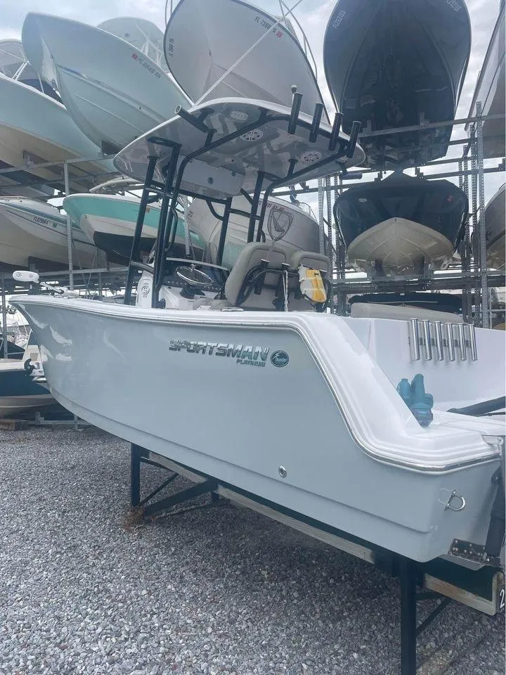 Slide: The Image of 2021 Sportsman Open 232 Center Console boat in storage, side view. - 6
