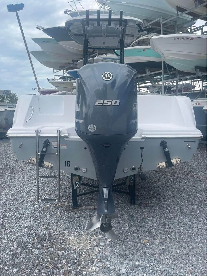 Slide: The Image of 2021 Sportsman Open 232 Center Console boat with Yamaha 250 engine, rear view. - 7