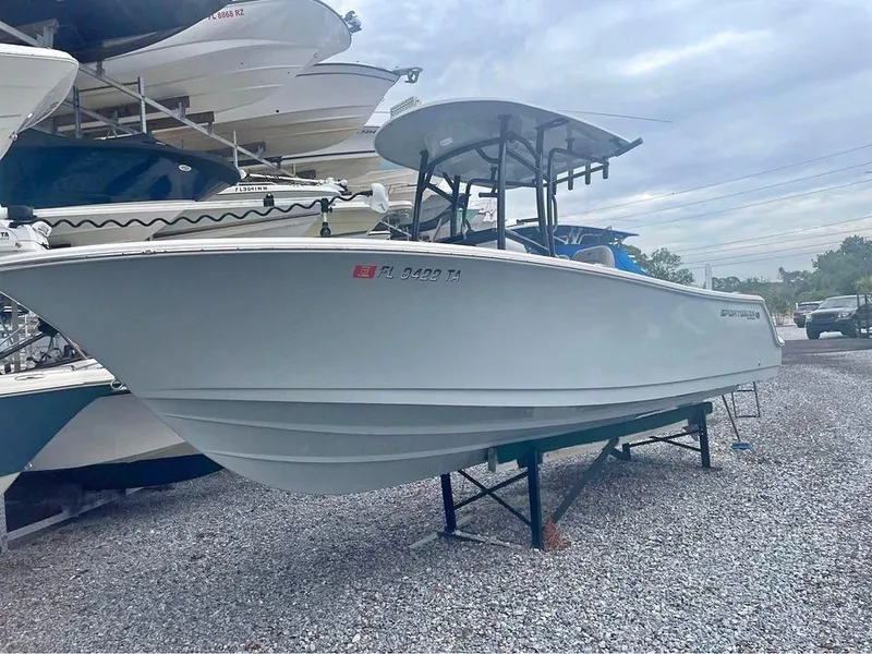 Slide: The Image of 2021 Sportsman Open 232 Center Console boat on gravel lot, side view. - 8