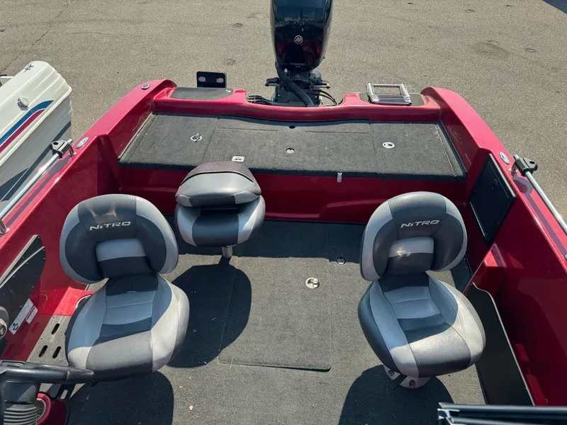 Slide: The Image of 2015 Nitro ZV 18 boat interior with two seats and motor. - 10