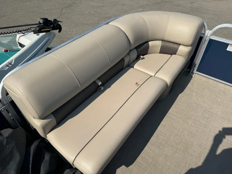 Slide: The Image of 2021 Sun Tracker Party Barge 20 DLX beige seating area on pontoon boat. - 11