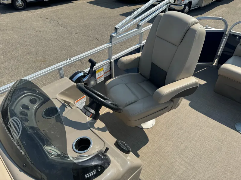 Slide: The Image of 2021 Sun Tracker Party Barge 20 DLX boat captain's chair and helm station. - 13