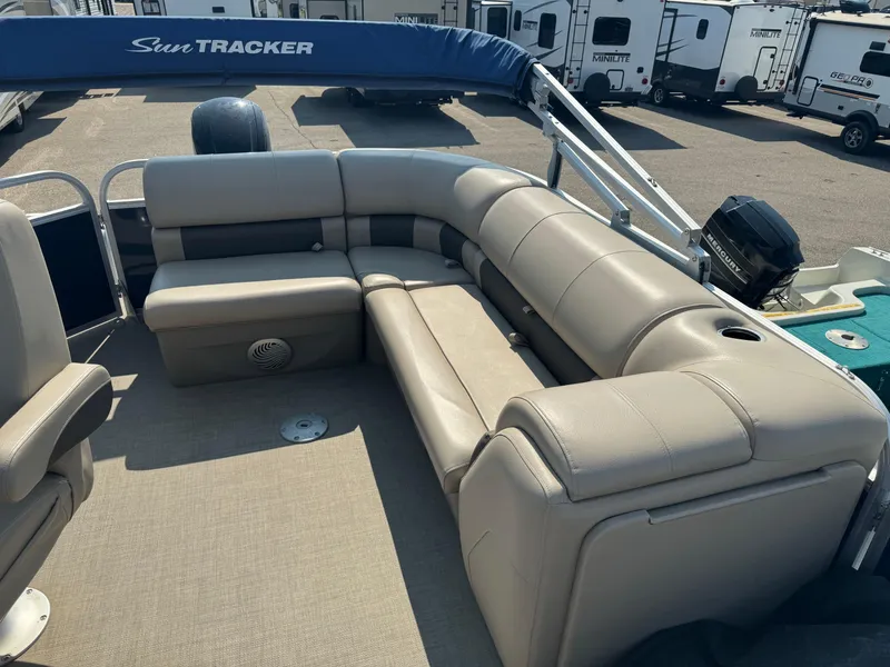 Slide: The Image of 2021 Sun Tracker Party Barge 20 DLX pontoon boat with beige seating and spacious deck. - 5
