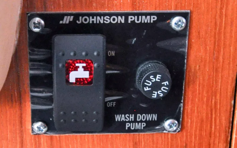 Slide: The Image of Hunter 45CC - Coralee - Aft Port Corridor - Deck Washdown Pump Switch - 129