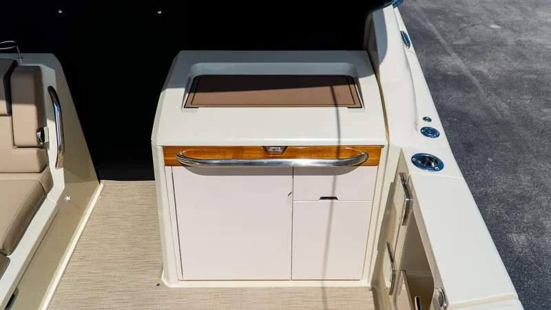 Slide: The Image of 2025 Chris-Craft 32 Calypso boat interior with sleek cabinetry and modern design. - 19