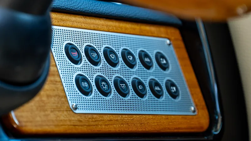 Slide: The Image of Control panel of 2025 Chris-Craft 32 Calypso with wood and metal accents. - 27