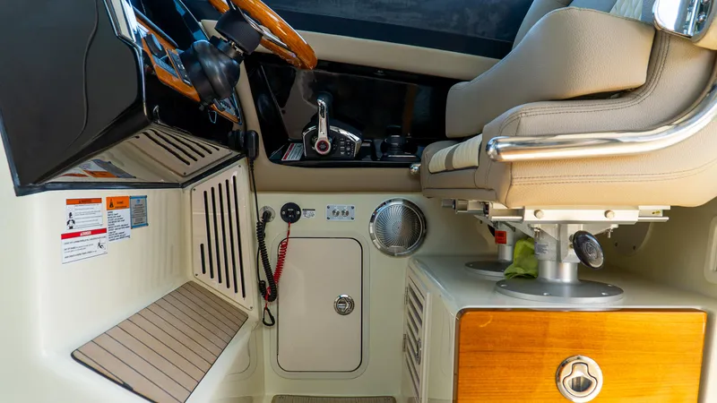 Slide: The Image of 2025 Chris-Craft 32 Calypso helm with luxurious seating and modern controls. - 29