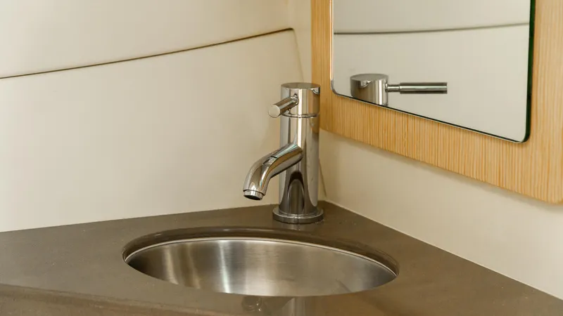 Slide: The Image of Luxury bathroom sink and mirror in 2025 Chris-Craft 32 Calypso boat. - 39
