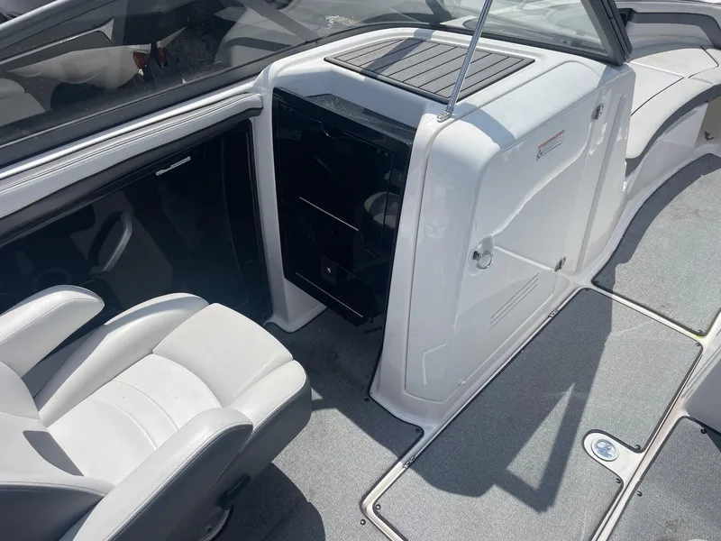 Slide: The Image of 2018 Yamaha Boats AR240 interior cockpit with seating and storage compartments. - 3